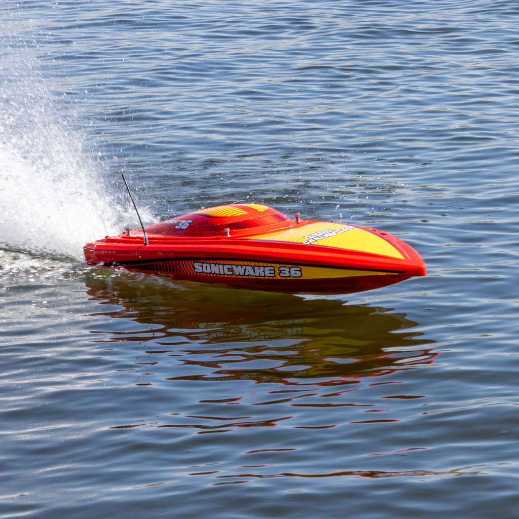 Pro Boat Sonicwake 36 V3 RTR, red, PRB-2171T2, front three-quarter view running on the water